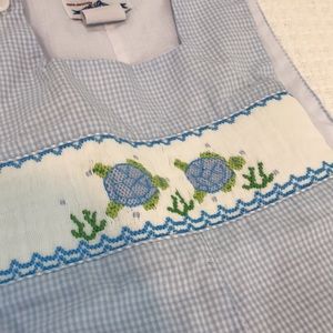 Turtle smocked shortall.